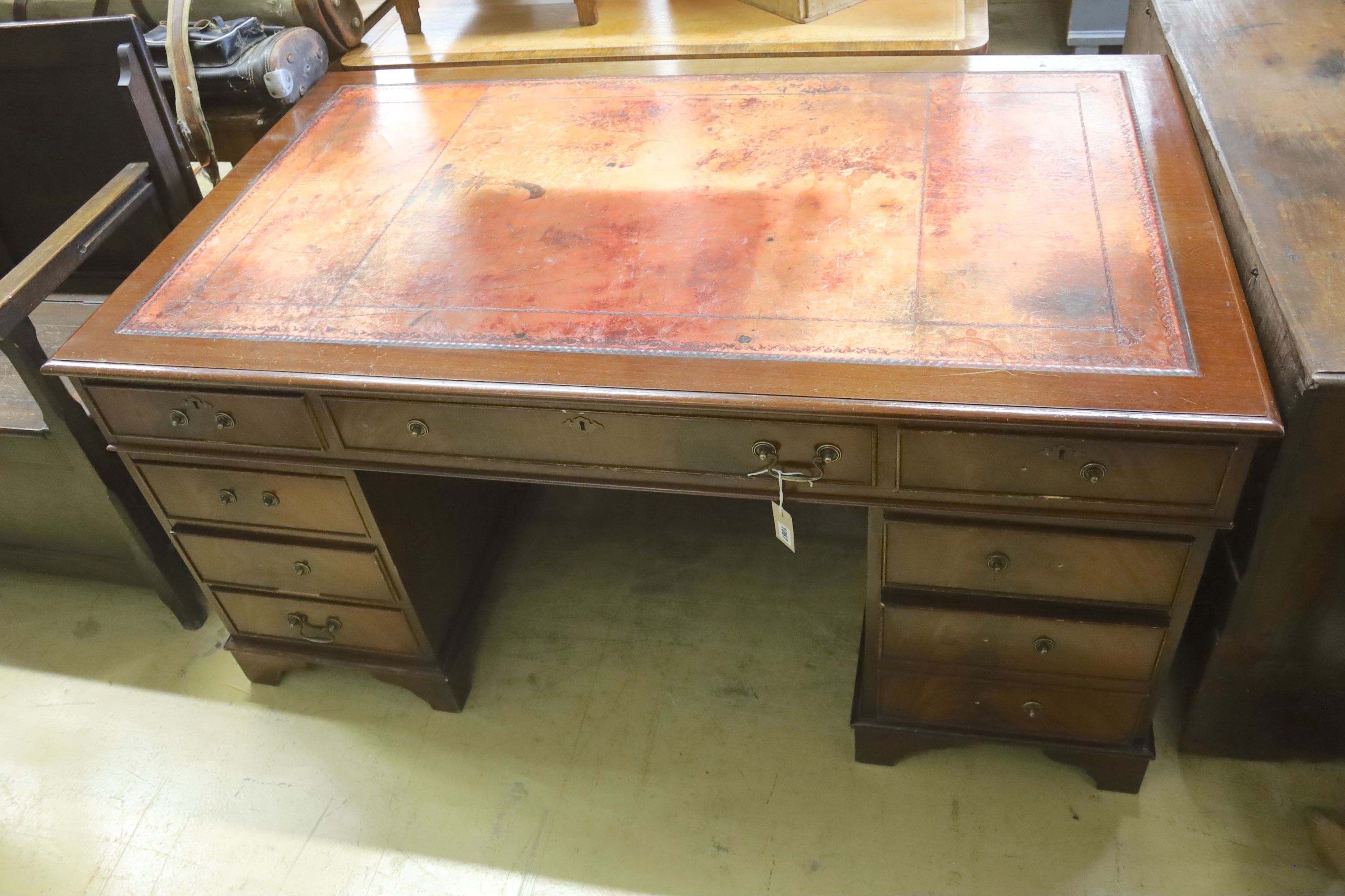 A reproduction mahogany pedestal desk, length 152cm, depth 91cm, height 74cm
